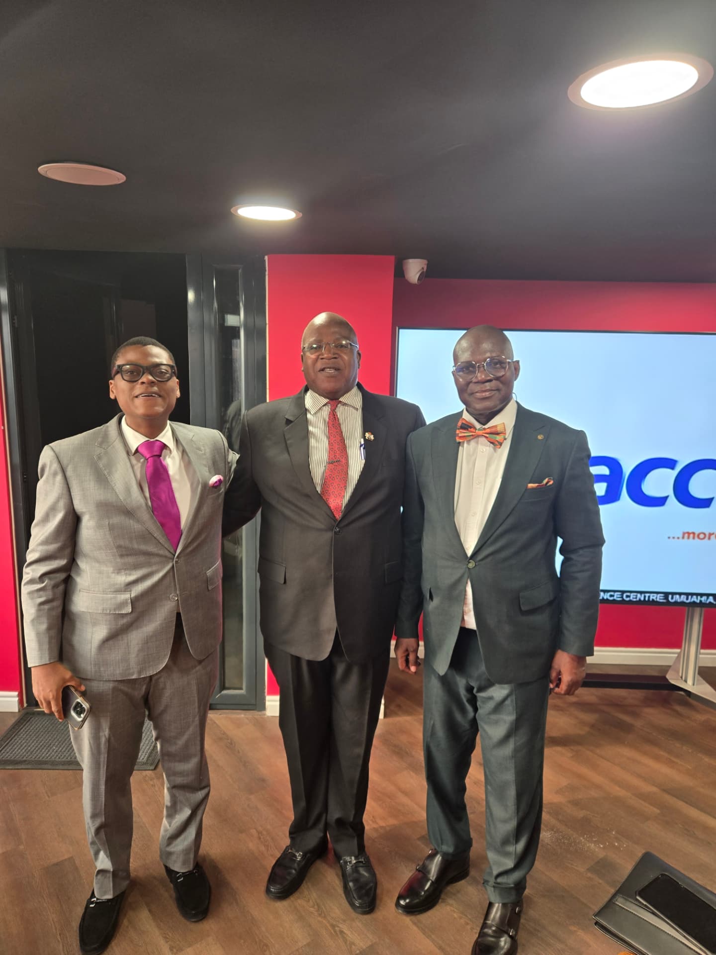 Three business leaders meeting at a conference venue