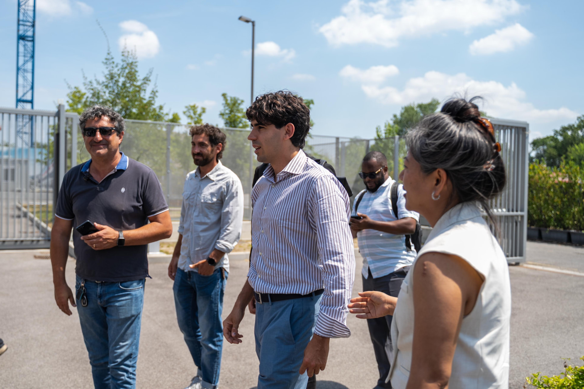A group of founders and partners in conversation outdoors